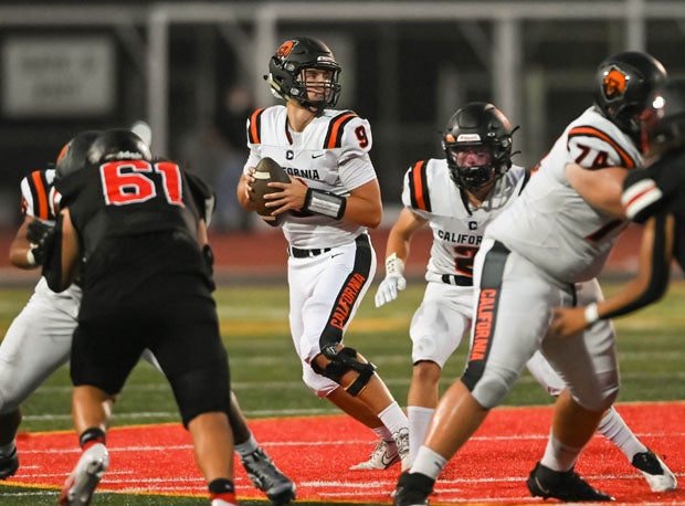 Teddy Booros (9) receives great protection while throwing for one of his 17 touchdown passes.