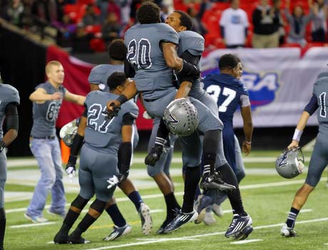 Norcross players celebrate on the field following their victory in the Georgia Class AAAAAA championship game on Saturday night.