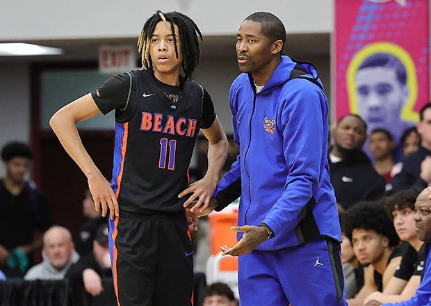 J.J. Crawford gets pointers from his father, NBA legend and Rainier Beach assistant coach Jamal Crawford at the Hoophall Classic last month. (PHOTO: Lonnie Webb)