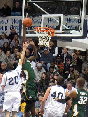 Gilchrist attempts a dunk during the win.