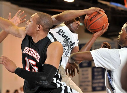 Travis Charles (21) grabs a loose ball helping Lincoln upend Harvard-Westlake.