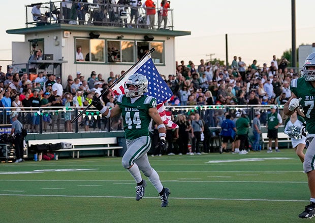 Bubba Vargas carried the Stars and Stripes proudly onto the field at De La Salle prior to Friday night's matchup with Lakeland. (PHOTO: Ernie Abrea)