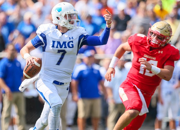 IMG Academy quarterback Shea Patterson motions to a receiver downfield.