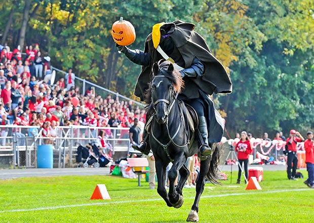 A headless horseman helps New York's Sleepy Hollow High School take the field before a football game in 2013.