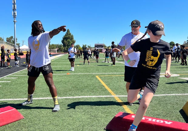 Najee Harris gives a little direction in the first D Bigger Picture Foundation Antioch Youth Football Camp Saturday at Eells Field on the campus of Antioch High School. 