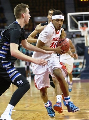 Denver East's Dominique Collier, right, scored 32
points in the quarterfinals to lead the Angels back
to the Class 5A Final Four.