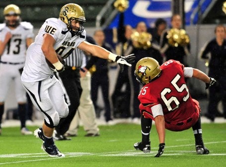 Oregon commit Johnny Mundt caught one of two Central Catholic completions, and in the process made Santa Fe Christian's Darrian Borboa lose his feet.