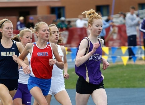Cherry Creek distance standout Jordyn Colter (red jersey) will try to defend her Class 5A state titles in the 800 and 1,600 meters beginning Thursday at Jeffco Stadium.
