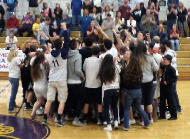 Dayton basketball fans storm the court after the Pirates sweep the 3A state playoff finals, taking both the girls and boys titles. For their feat, the Pirates are the MaxPreps Oregon Teams of the Week, presented by the Oregon National Guard.