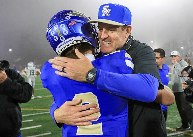 Santa Margarita head coach Carson Palmer embraces quarterback Trace Johnson after Saturday's championship game triumph. (PHOTO: Rene Morales)
