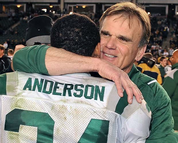 Ladouceur hugs Tyler Anderson while celebrating the Spartans' 2009 victory over Crenshaw in the CIF State Open Division Bowl Game at the Home Depot Center.