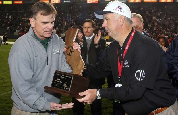 Ladouceur receives the championship trophy following the Spartans' 2008 victory over Centennial in the CIF State Division I Bowl Game at the Home Depot Center.