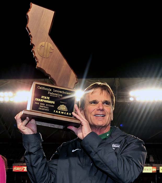 Ladouceur hoists the championship trophy following the Spartans' victory over Centennial in the CIF State Open Division Bowl Game on Dec. 15 at the Home Depot Center.