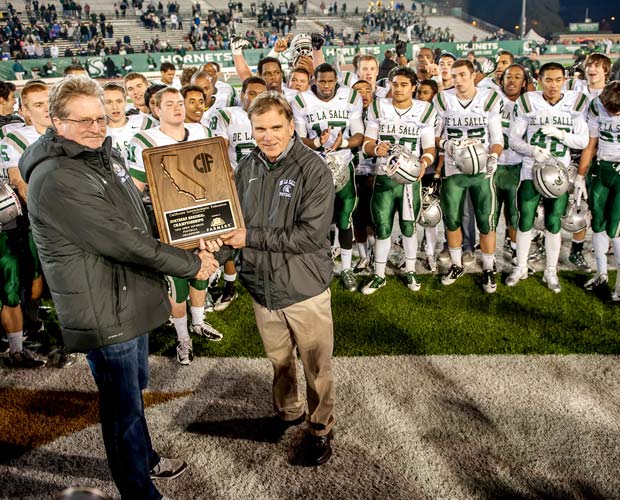 Ladouceur receives the championship plaque from CIF Executive Director Roger Blake following the Spartans' victory over Folsom in the CIF NorCal Open Division title game, Dec. 8 at Sacramento State.