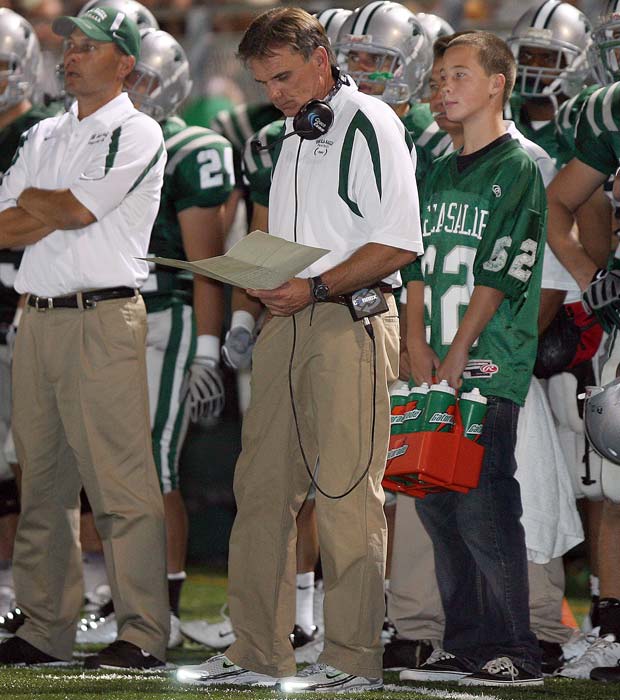 Ladouceur looks over his play chart during a home game against Don Bosco Prep (N.J.) in 2008.