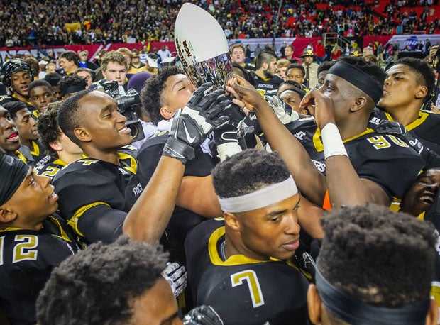 Colquitt County players celebrate after winning the 2014 Georgia 6A state title.