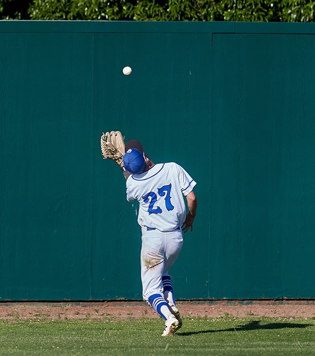 Capital Christian (Calif.) centerfielder Brett Graber makes a stellar over-the-shoulder catch that prevented Escalon from tying the game during the sixth inning of a CIF Sac-Joaquin Section Division 4 playoff matchup.