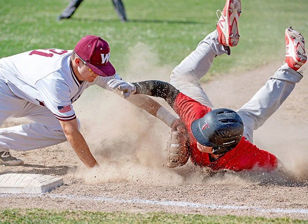 Whitney (Calif.) first baseman Christian Kolaskey puts a tag on an Antelope baserunner during a pick-off play.