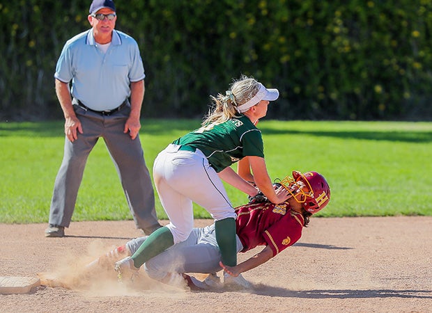 Molly Mirabeli of La Reina (Calif.) tags a sliding Evelyn Flores of Hillcrest at second base during a CIF Southern Section Division 5 playoff game.