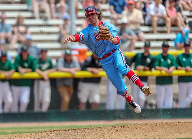 Third baseman Conner Cummiskey of Heritage (Colo.) throws out a runner at first during the CHSAA 5A championship game against Mountain Vista.
