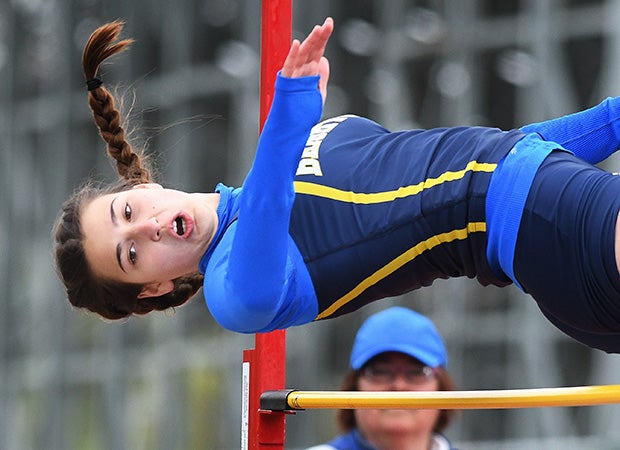 An athlete looks to clear the high jump bar while competing in the Royal Comet Invitational in New York.