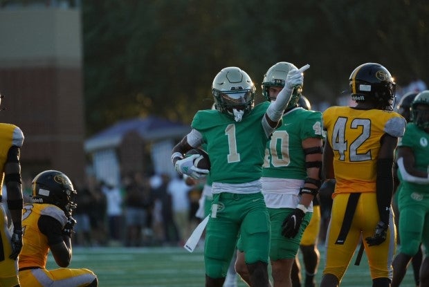 Five-star Florida State commit K.J. Bolden celebrates a first down for Buford as the Wolves won their season opener, 18-0 over No. 6 St. Frances Academy. (Photo: Michael Mixon)