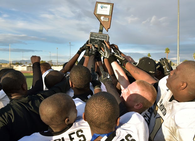 Spring Mountain players hoist the state championship trophy.