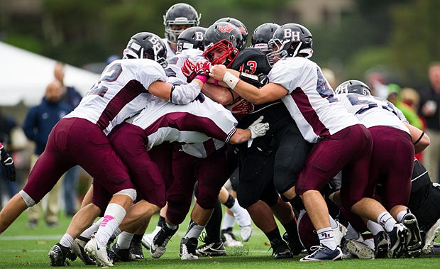 The Belmont Hill (Belmont, Mass.) defense stops a St. Sebastians's School (Neddham, Mass.) player in his tracks.