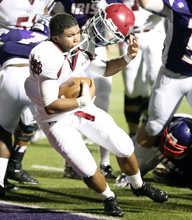 Derrick Tusie of Montgomery Bell Academy (Nashville, Tenn.) loses his helmet on his way into the end zone.