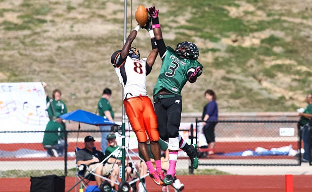 Players from Ritenour (Overland, Mo.) and Pattonville (Maryland Heights, Mo.) go up for a jump ball.