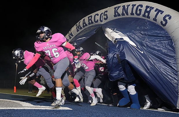San Marcos (Calif.) storms the field in its pink uniforms to support breast cancer awareness.