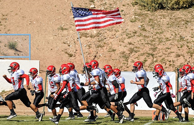 Centennial (Las Cruces, N.M.) exhibits a patriotic entrance to the game.
