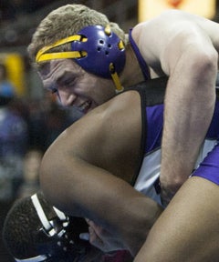 Mesa senior Ben Andrew, right, continuedthe dominance he showed inArizona at the national level by winning the220-pound Folkstyle National title.