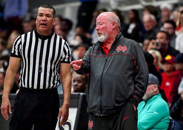 Gary McKnight exchanges in some friendly banter with an official during a playoff game in March. (Photo: Louis Lopez)
