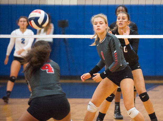 Lovejoy's Annabelle Archer watches as defensive specialist Shanel Bramschreiber receives a ball.