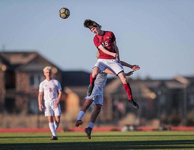 Cherokee Trail (Colo.) senior Luke Simmons leaps for a header against visiting Cherry Creek.