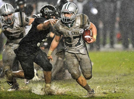 Lucas Dunne didn't let the conditions slow him down rushing for 240 yards and four touchdowns.
