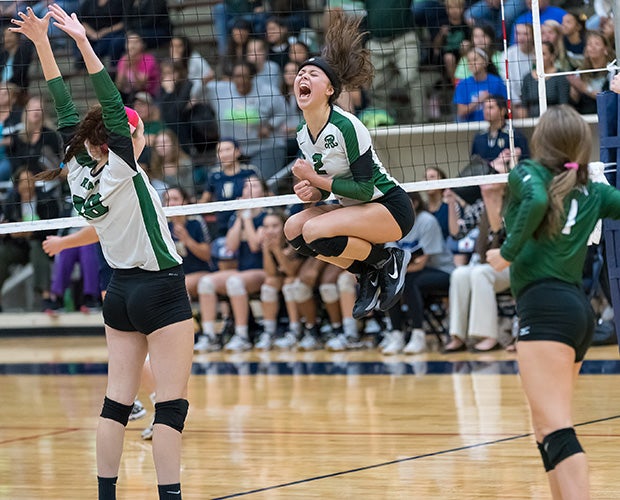 Tori Hinojosa of Reagan (Texas) leaps while celebrating the final point in the second game against O'Connor in a UIL 6A regional quarterfinal playoff match.