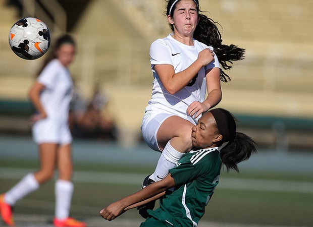 A Granada Hills (Calif.) player (top) collides with a Hamilton (Los Angeles) player while battling for the ball during a game in the Los Angeles Invitational.
