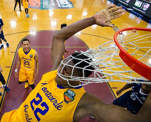 Montverde Academy (Fla.) forward Silvo de Sousa finishes a dunk during a semifinal game against La Lumiere in the DICK'S National Tournament in New York.