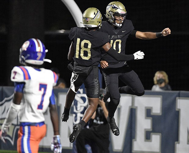 Bosco quarterback Pierce Clarkson (right) celebrates one of his two rushing touchdowns with teammate Jahlil McClain. 