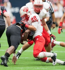 Katy defensive back Colton Asheim
(22) with another big hit. 