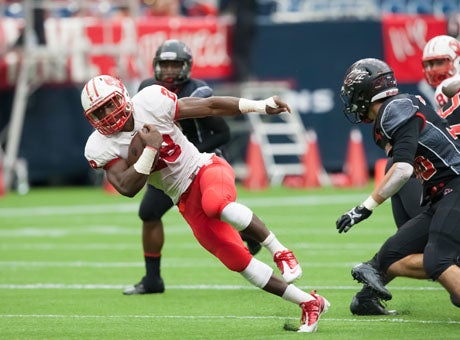 Adam Taylor goes sideways en route to 190 yards rushing and three touchdowns in this second-round rout for Katy.