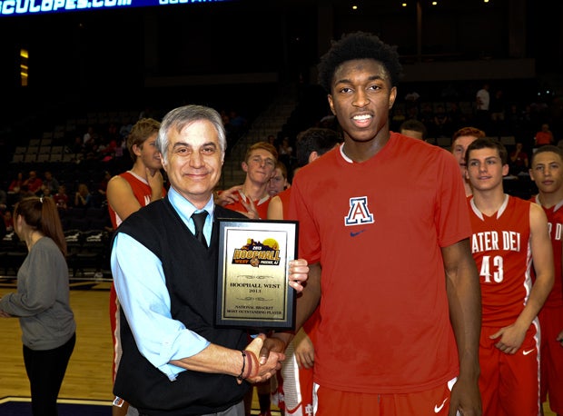 Johnson accepts his MVP plaque at the Hoophall West Tournament.