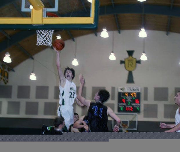 Sam Nieslanik (22) goes up high for a floater for Regis, which is the MaxPreps Oregon Team of the Week. 