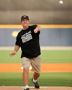 LaBounty throwing the first pitch at a local
AA game following the state title win.