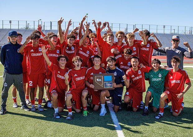 Coronado celebrates after beating Palo Verde 8-1 to capture the Class 5A Southern Region title. The Cougars went 25-0 this fall, outscoring opponents 187-12. (PHOTO: Jenni Webber)