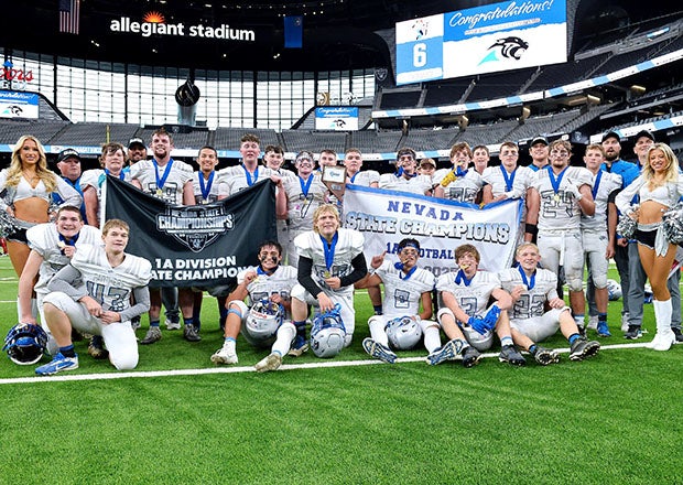 Although Bishop Gorman garners many of the football headlines coming out of Nevada, Pahranagat Valley has actually won more state titles at the 8-man level. The Panthers are pictured here after winning their 24th state crown last November, the most of any 8-man program in the country. (PHOTO: Jules Karney)