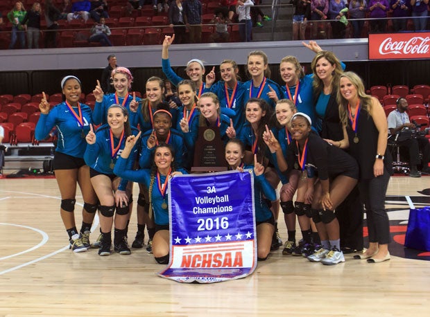 Small school Coach of the Year Michelle Phillips and her Cox Mill team after winning the North Carolina 3A volleyball title.