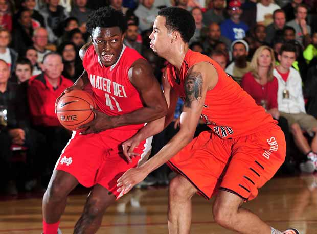 Leading scorer Stanley Johnson drives the lane Saturday at the Nike Extravaganza against Whitney Young.